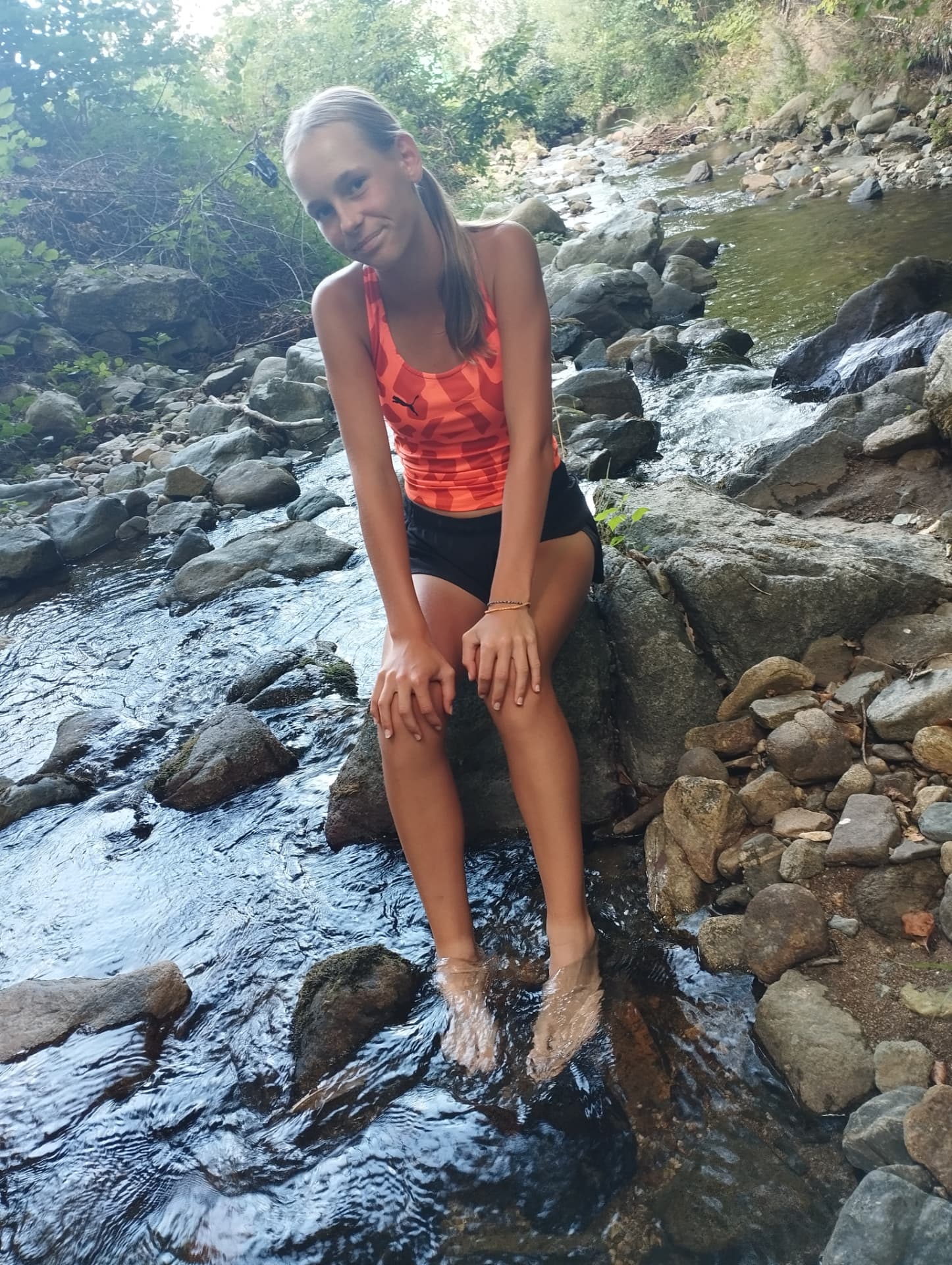 Julia after training, resting by a stream